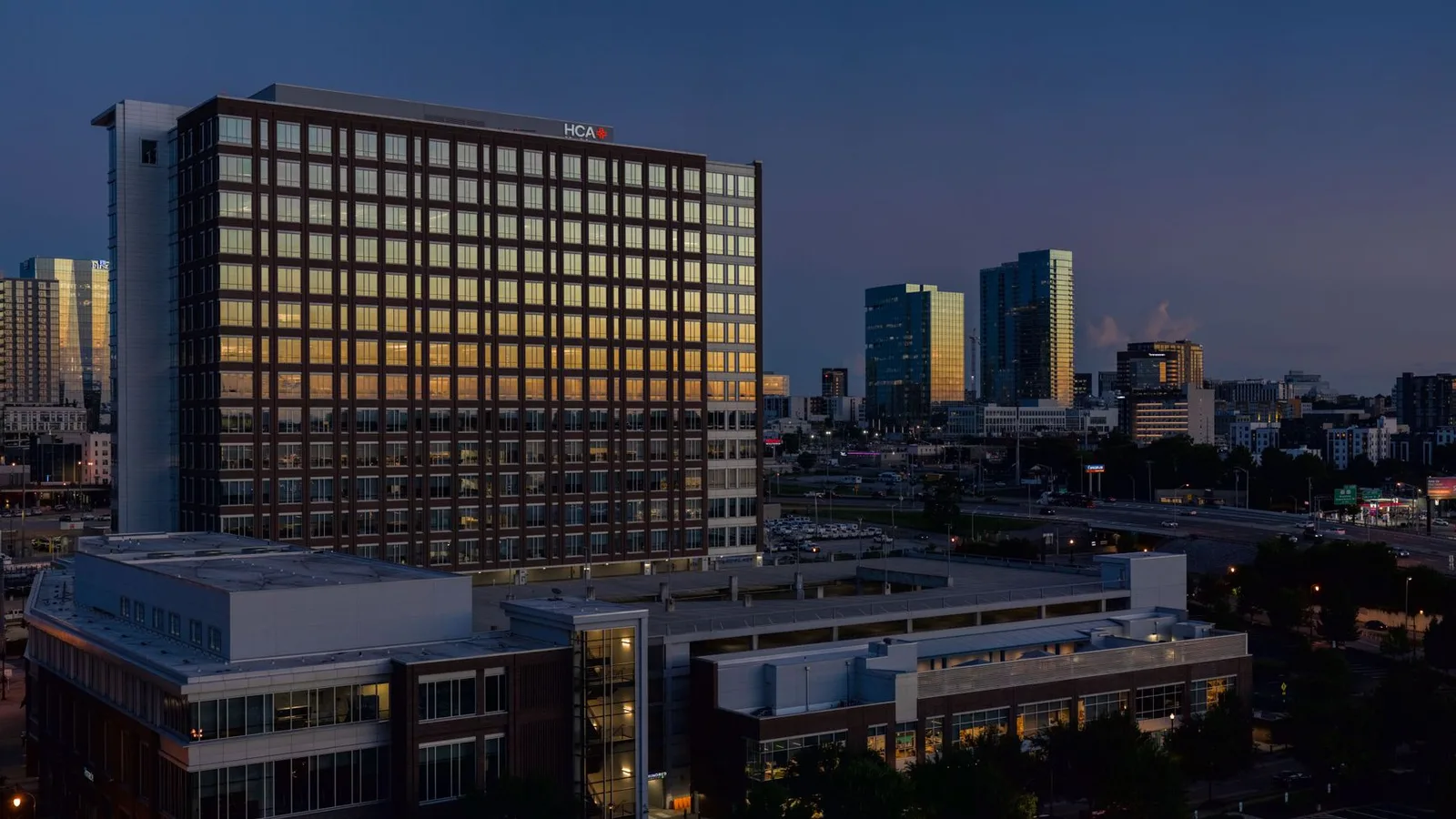 Stunning view of the Nashville skyline at sunset highlighting modern architecture and city lights.